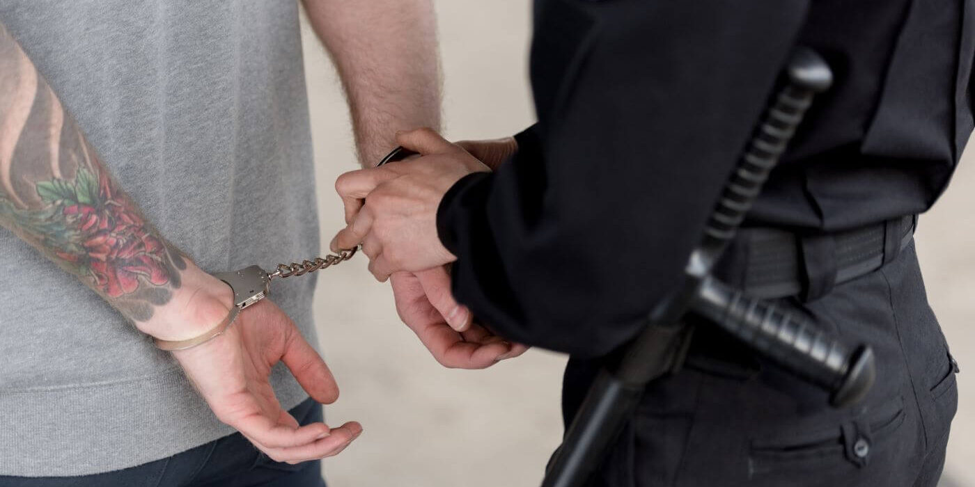 cropped-shot-of-policewoman-with-truncheon-handcuf-2022-12-16-16-36-41 (1)