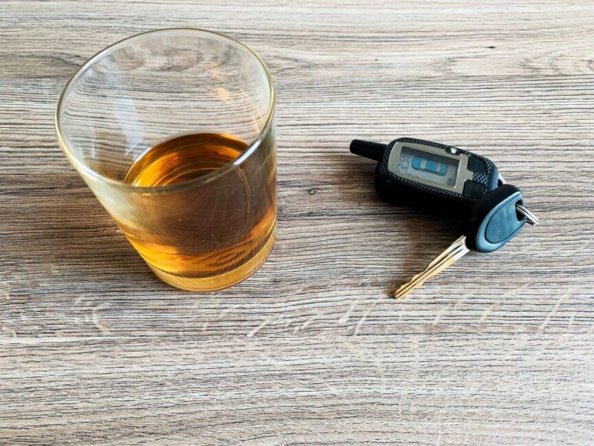 drunk-driving-concept-glass-with-whiskey-and-car-2023-02-24-16-14-26 (1)